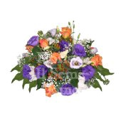 Round centerpiece arrangement with fresh season flowers and candles